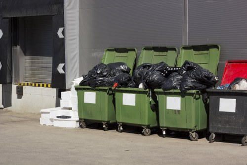 Workers sorting recyclable materials at a depot